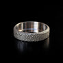 Close-up of Sevruga deep engraving on Forma Nova titanium beauty ring