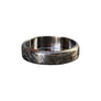 - Polished titanium and deep engraving on Forma Nova Damascus ring