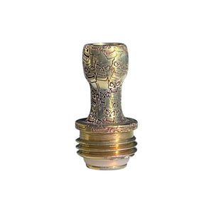 A titanium Boro drip tip colored in gold with agressive Bart skulls