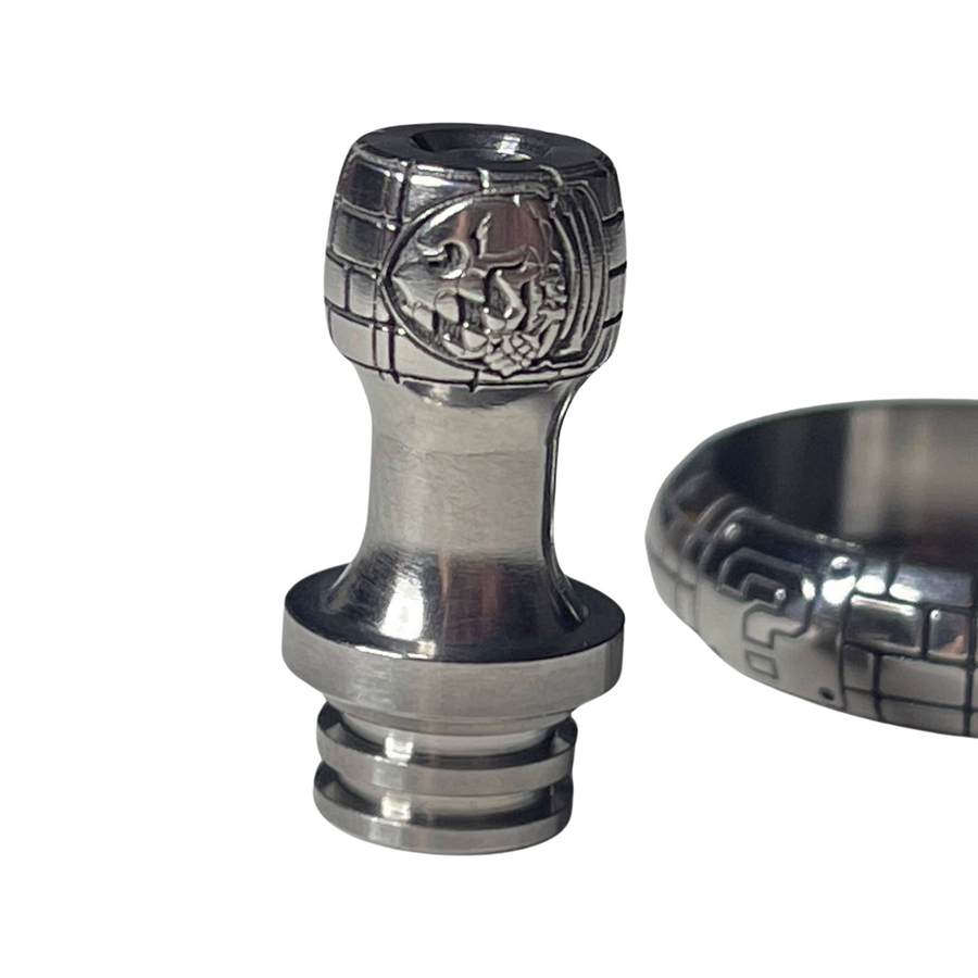 Engraved titanium 510 drip tip designed by Laser Custom Works. One Mario Bullet skull on a side and the famous Question Mark on the other side. Background is formed of bricks wall like in the Mario game. 